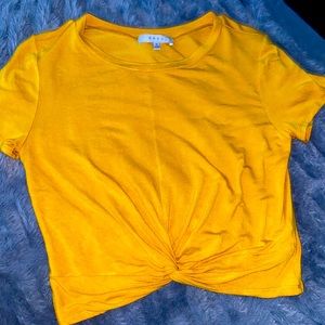 Bright yellow cropped shirt
